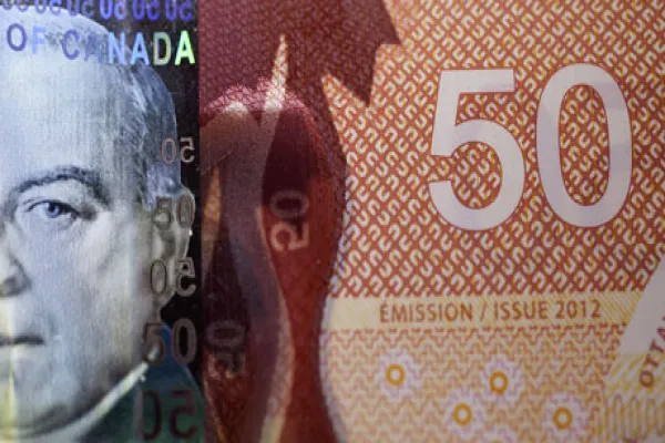 Canada's Dollar at Almost Eight-Month Low Before Economic Report