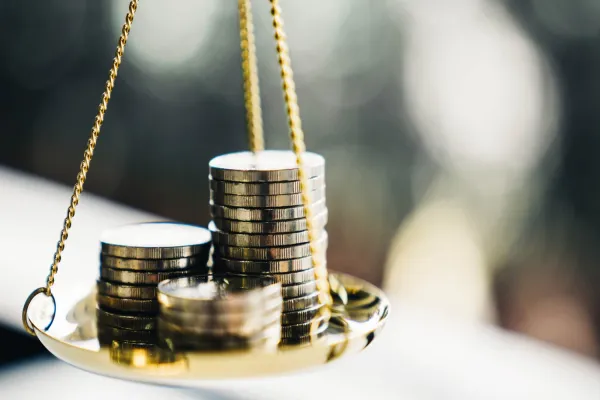 Coins stack with balance scale. Money management, financial plan, time value of money, business idea and Creative ideas for saving money concept.