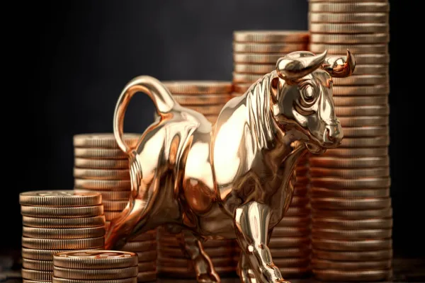 Golden bull and coins . Financial investment in bull market and growth of stock market concept.