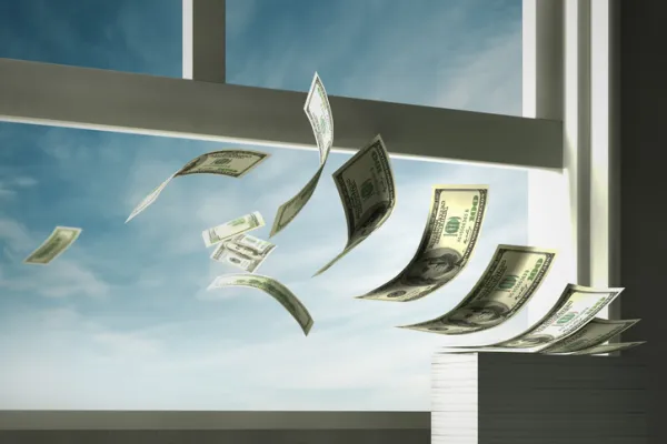 Paper currency blowing out of open window