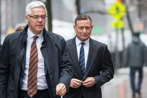 Douglas Hodge, right, enters federal court in Boston, Massachusetts on Feb. 7, 2020. (Scott Eisen/Bloomberg)