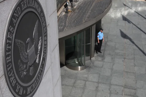A security officer stands outside the U.S. Securities and Exchange Commission headquarters