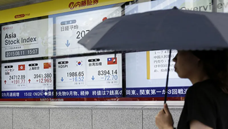 Stocks Boards And Chinese Yuan Banknotes AS China Devalues Yuan by Most in Two Decades