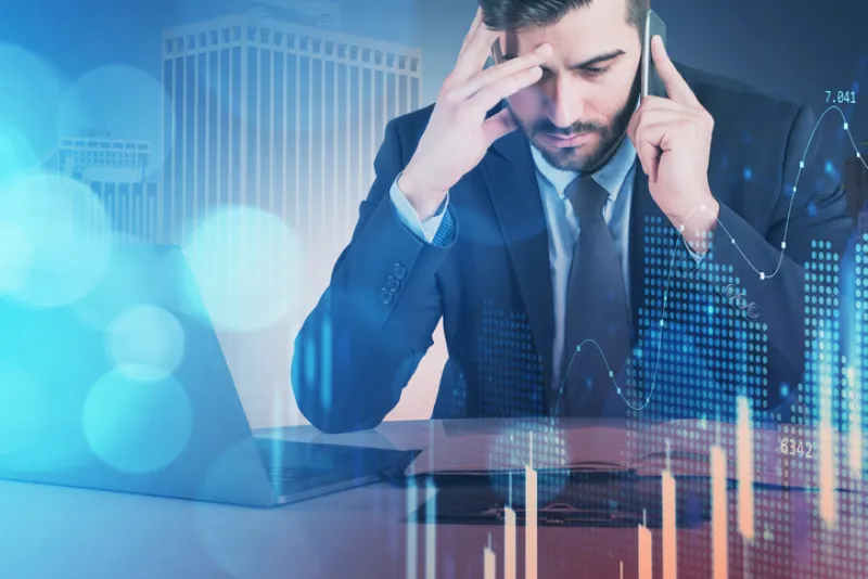 Business man or stock trader analyzing stock graph chart by fibo