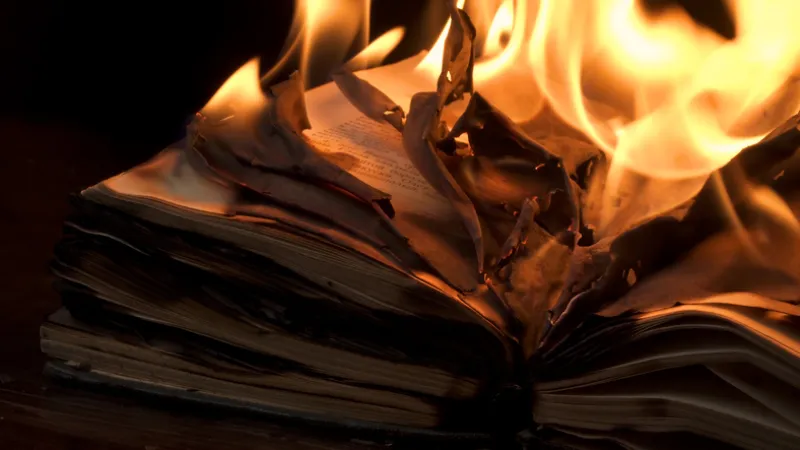 An open book is on fire